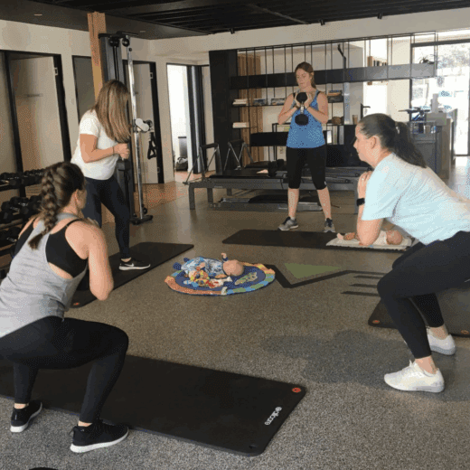 Group of pregnant women weight training.
