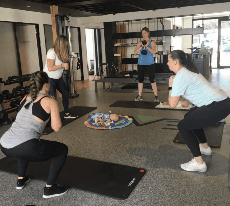Group of pregnant women weight training.