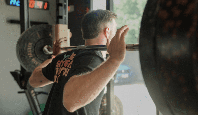 Person performing strength training exercise in a gym for rehabilitation