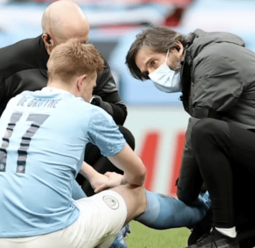 Football player receiving medical treatment for a high ankle sprain injury