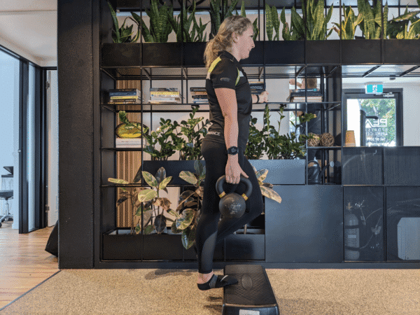 Weighted calf raises for stiff ankles to improve ankle mobility and calf strength