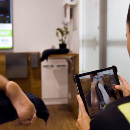 PEAK podiatrist assessing a runner's foot and lower limb biomechanics